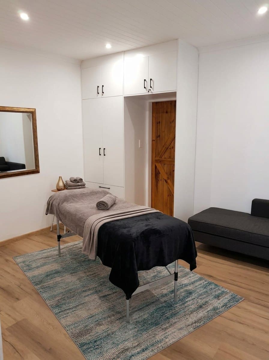 Massage table with towels in the Serendipity Wellness massage studio in Edgemead, Cape Town