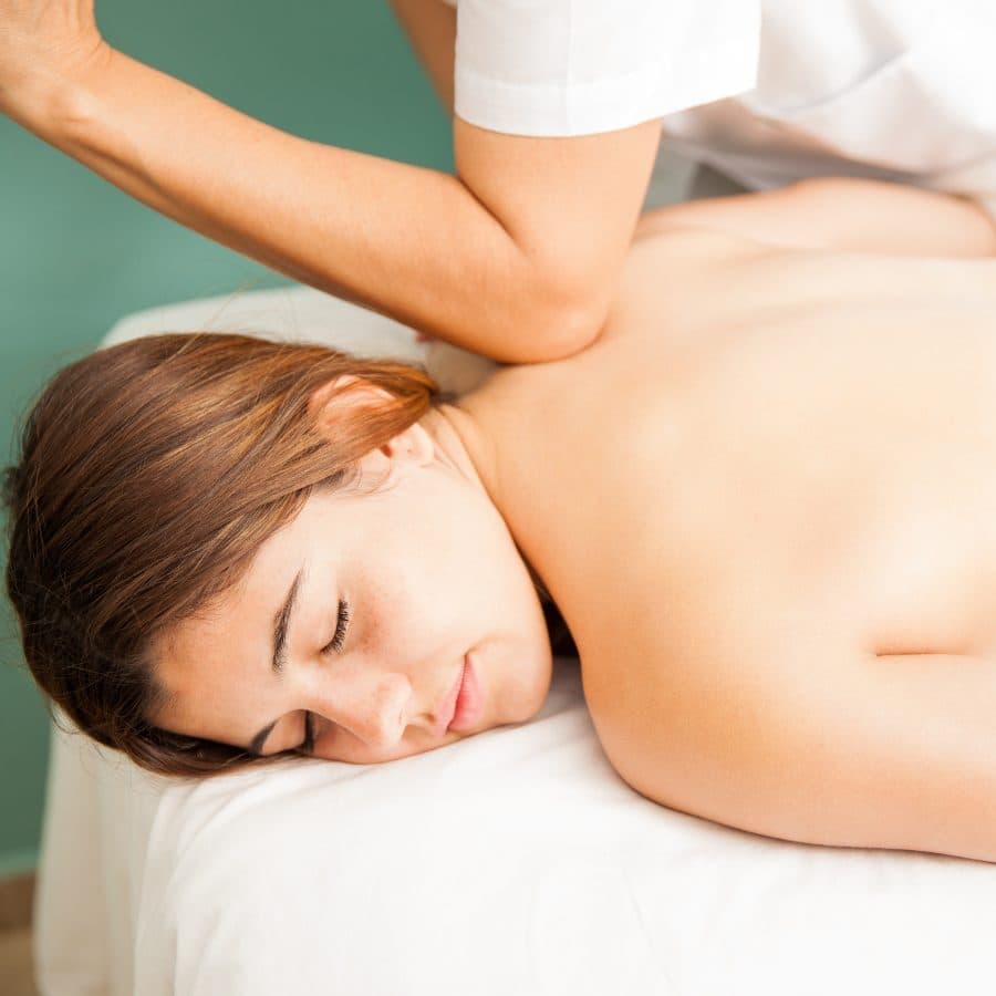 Client relaxing during a shoulder massage
